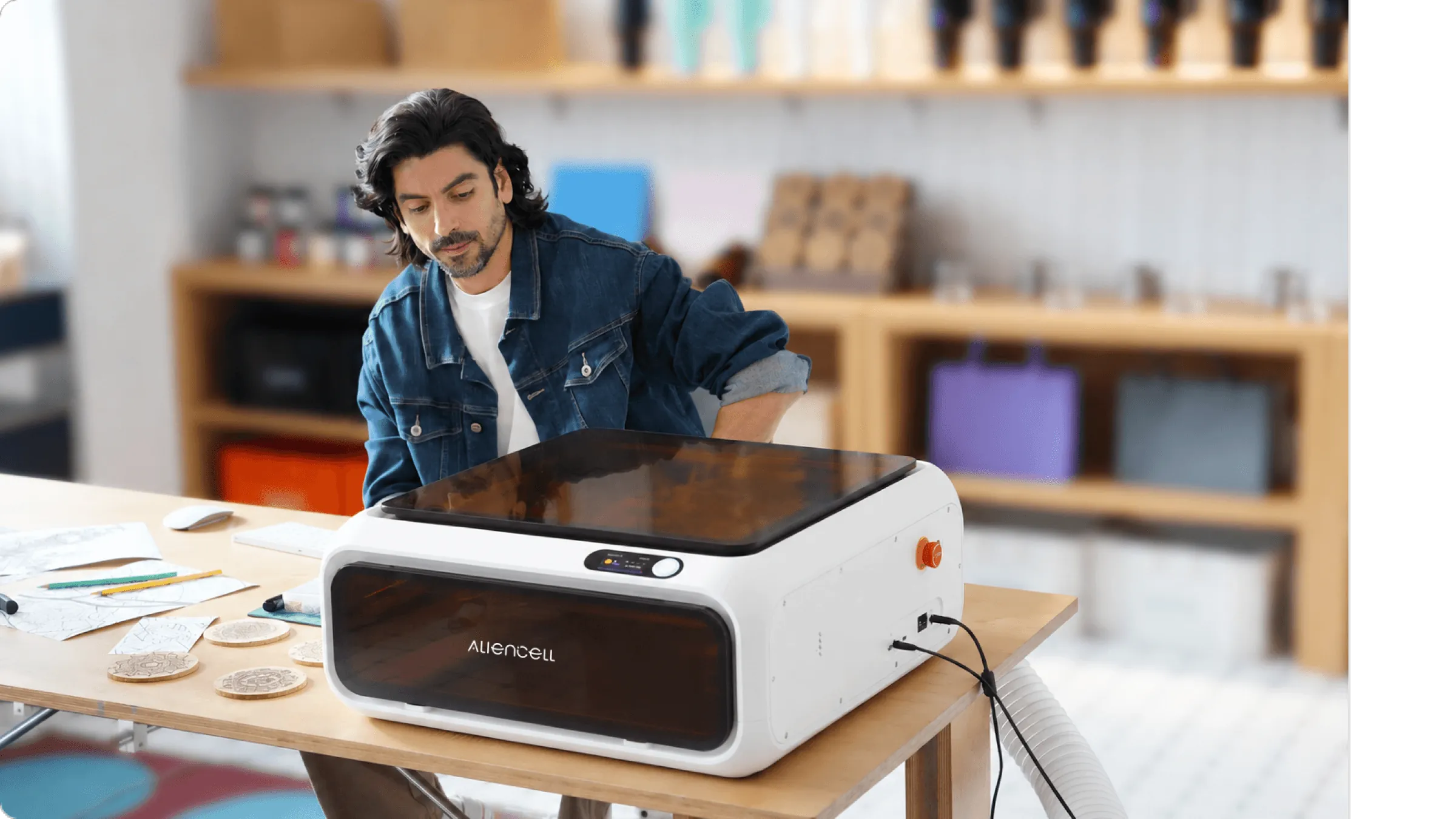 A maker working with Aliencell E1 in a workshop